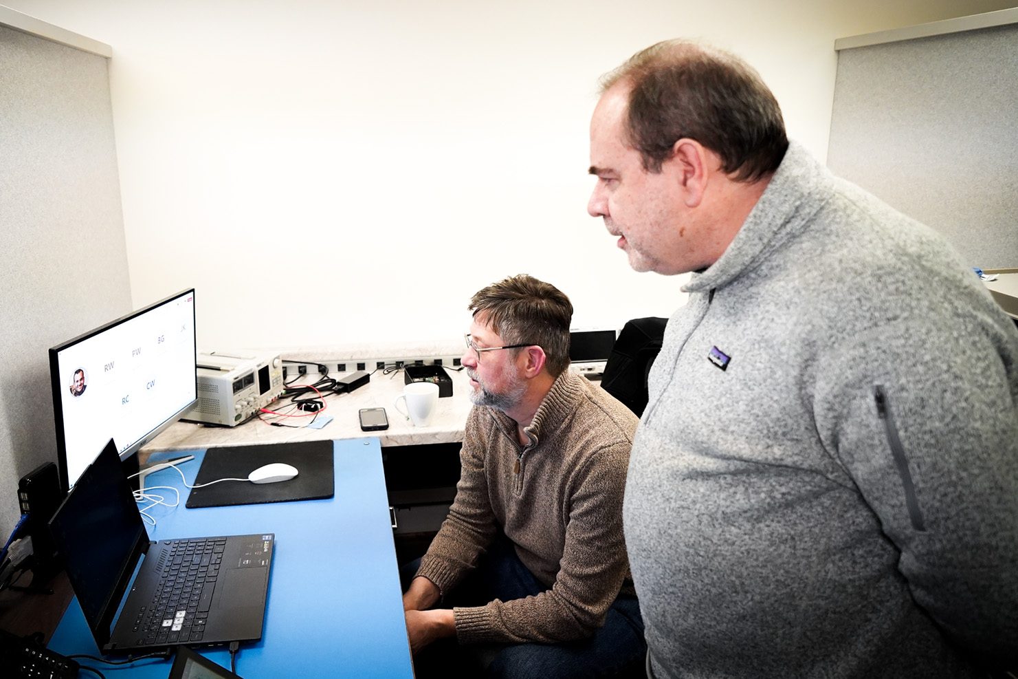 Collaborative Design Engineering Department discussing project with customer