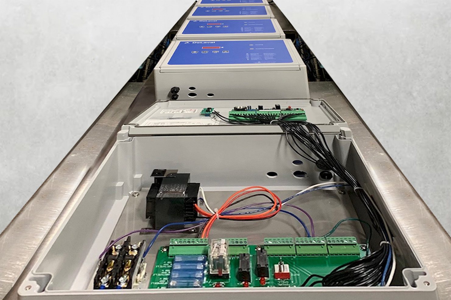 Box Builds on Conveyor PCB Assemblies on conveyor awaiting finishing
