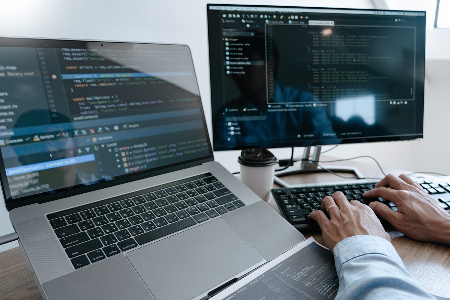 Developer writing code on computer