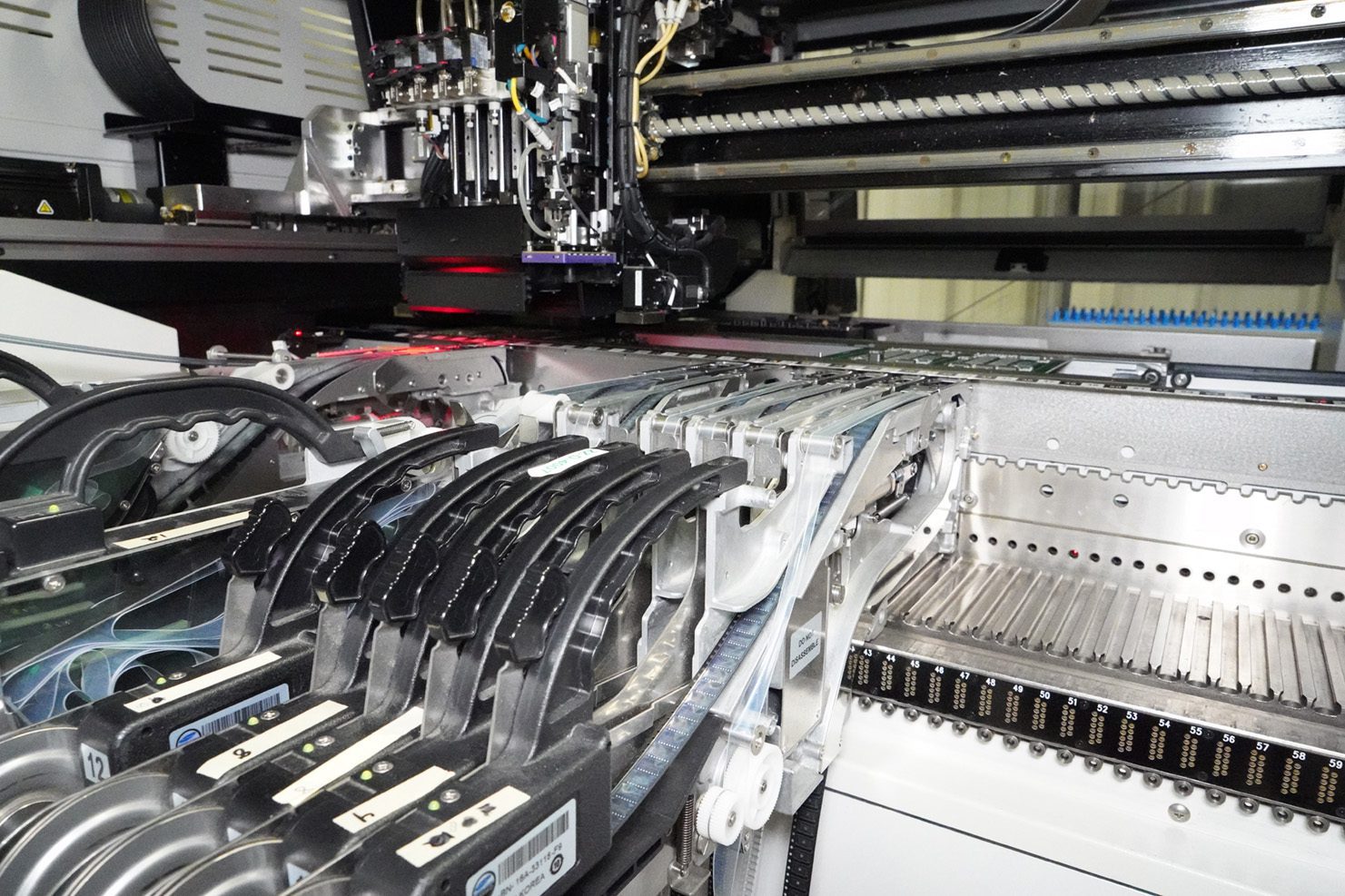 SMT Pick and Place Machine Component reels feeding into SMT machine