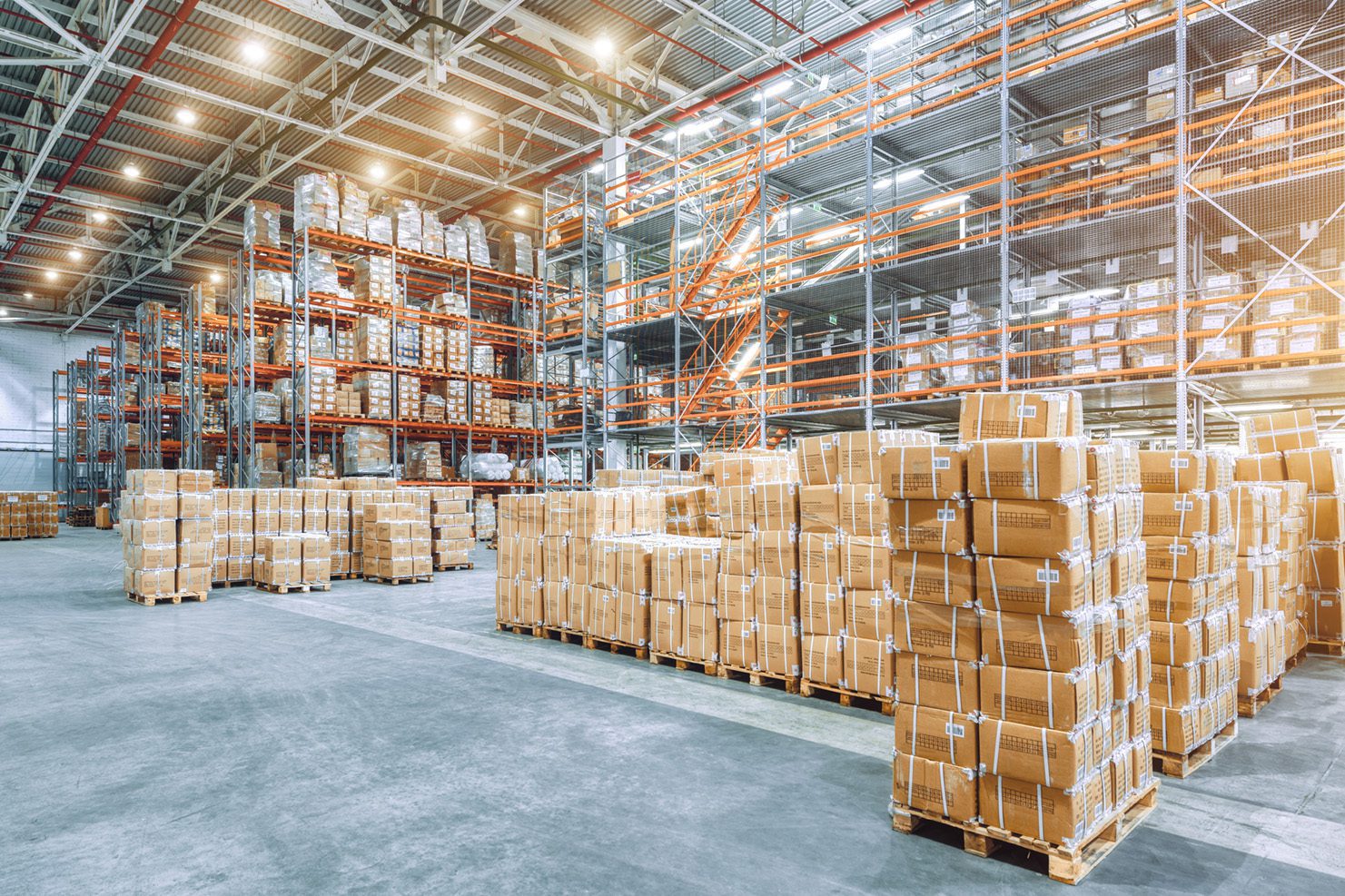 Warehousing as a Service Tall racks with product in boxes on pallets stacked high